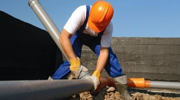 A Man Repairing the pipe
